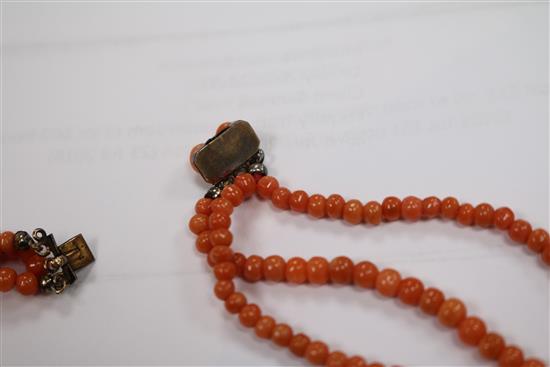 A triple strand graduated coral bead necklace, gross weight 51 grams, 50cm.